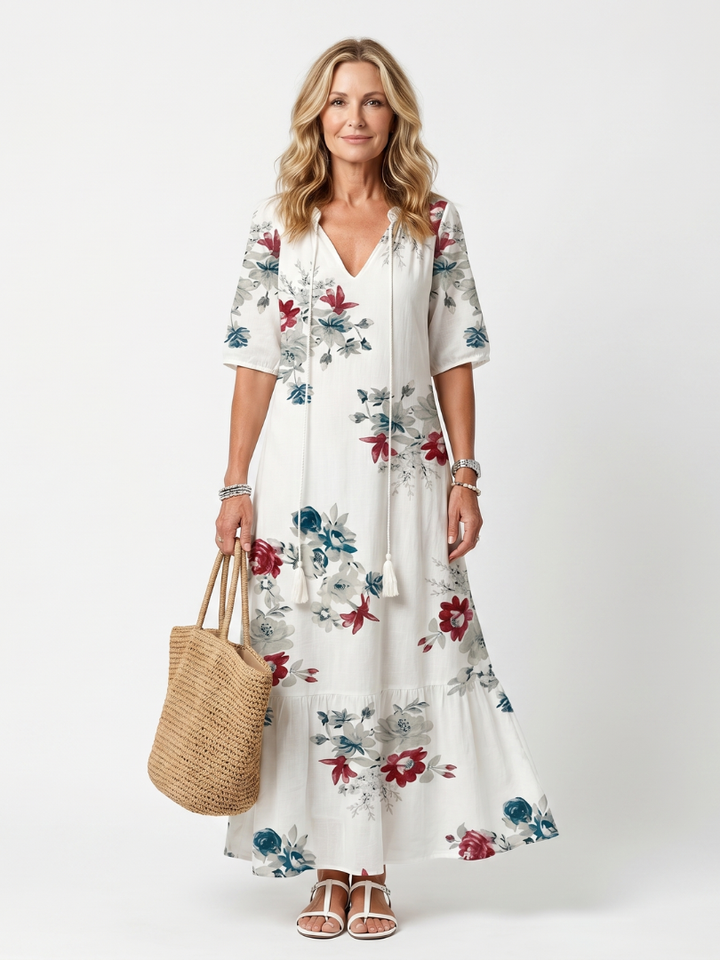 Maeva | Midikjole med spredt blomsterprint og kvastbånd