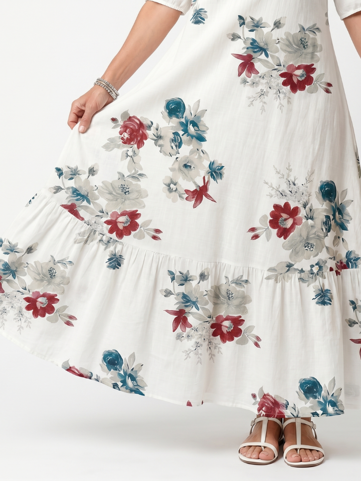 Maeva | Midikjole med spredt blomsterprint og kvastbånd