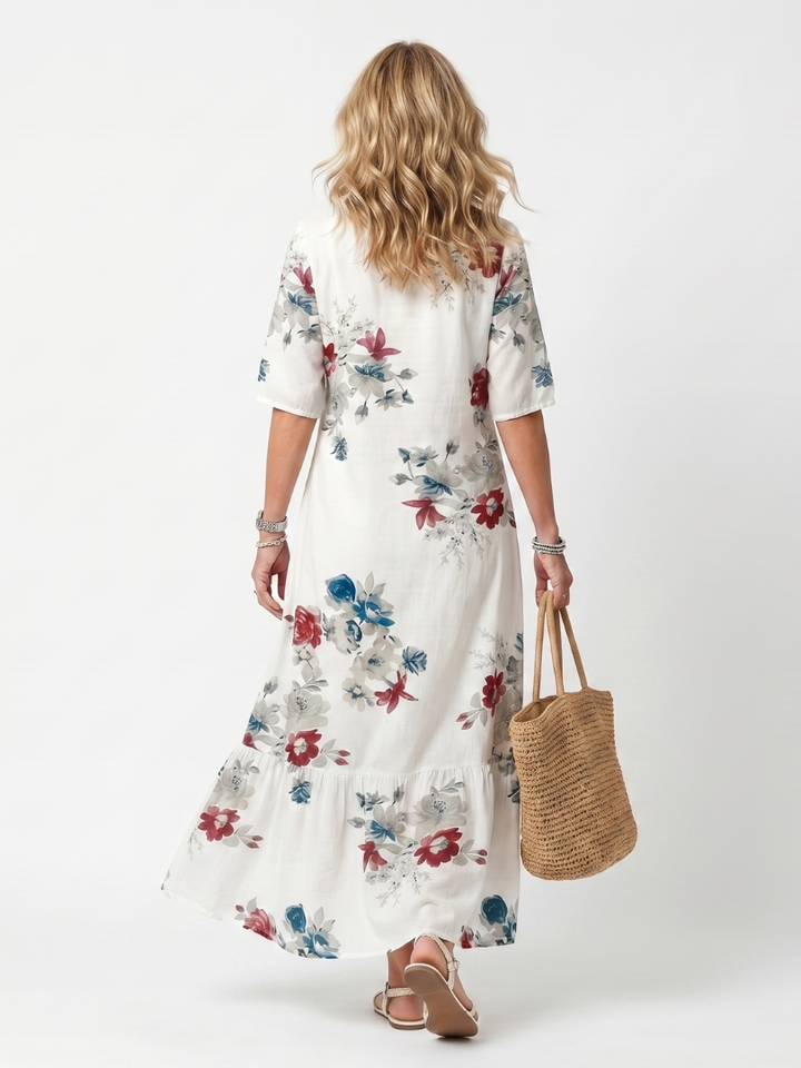 Maeva | Midikjole med spredt blomsterprint og kvastbånd