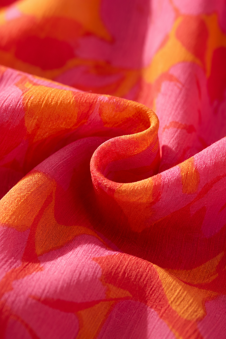 Olympe | Flydende kjole i rosa og orange