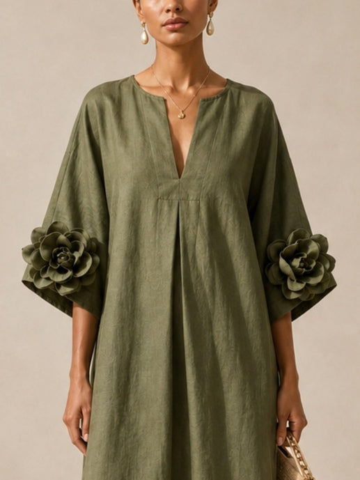Olivegrøn midikjole med V-udskæring og markante blomsterærmer